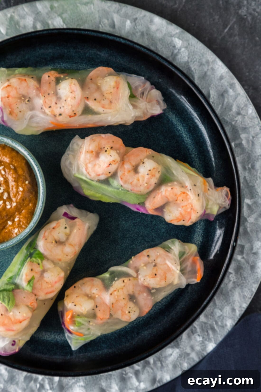 Hand-Rolled Shrimp Delights 2 Close up overhead photo of Shrimp Spring Rolls on a plate, showcasing their vibrant filling