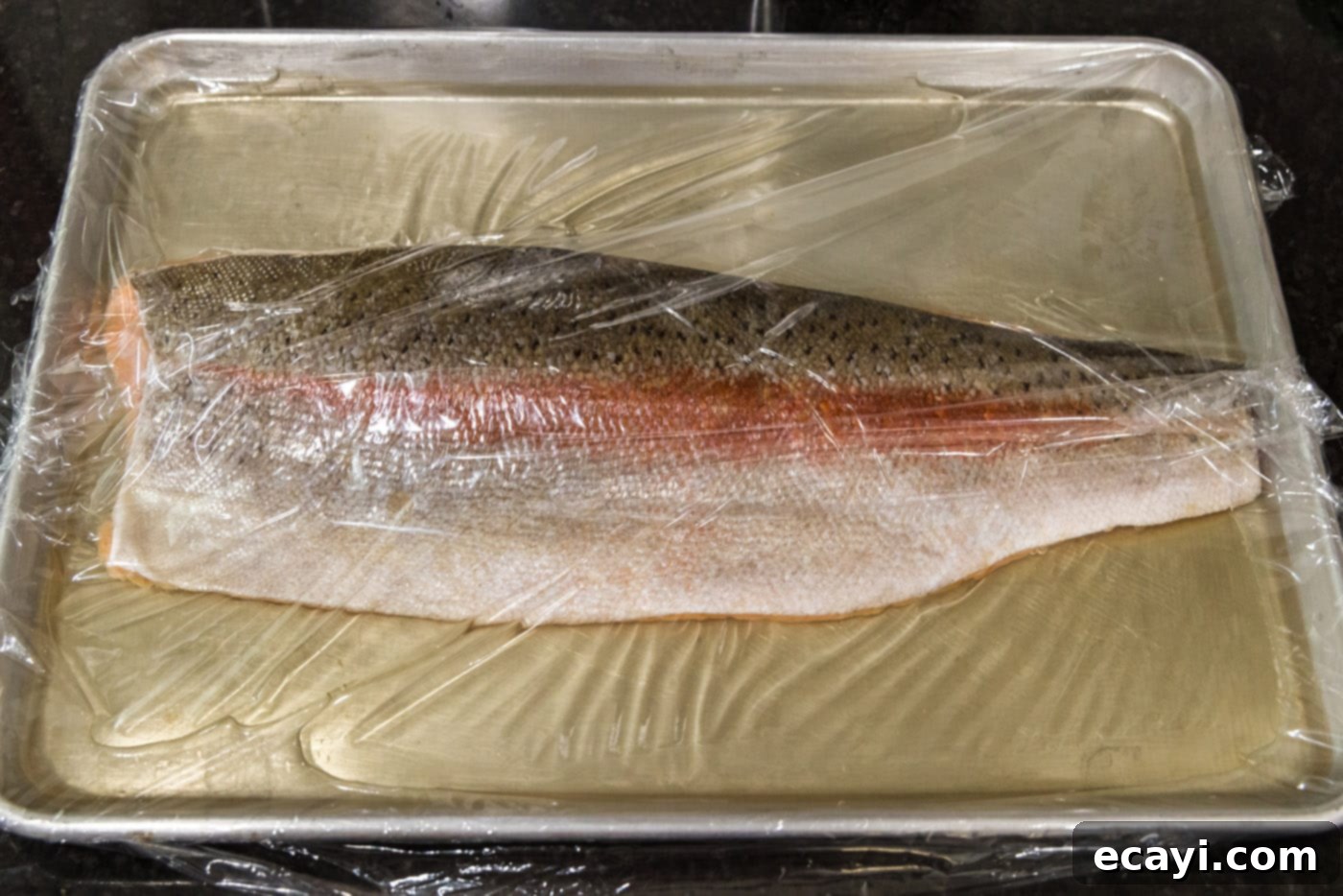 Artisan Smoked Trout 6 Trout fillets brining in a mixture of water, salt, and brown sugar.