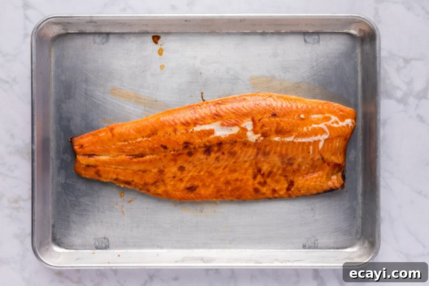 Artisan Smoked Trout 8 Finished smoked trout fillets on a baking sheet, ready to serve.