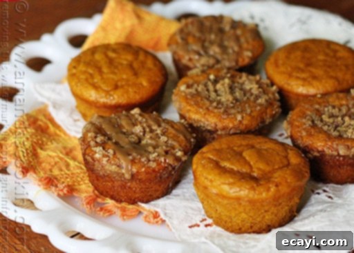Cozy Pumpkin Mini Cakes with Cinnamon Streusel 17 A plate of pumpkin mini cakes with cinnamon streusel topping.
