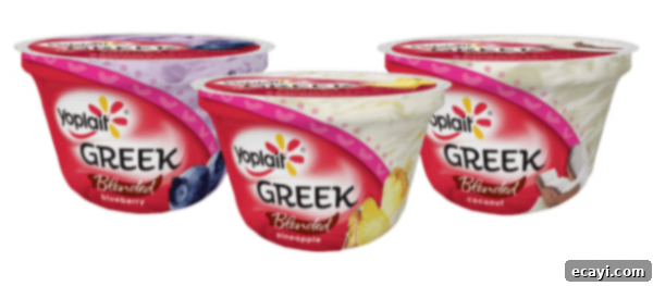 Cozy Pumpkin Mini Cakes with Cinnamon Streusel 4 A photo of three Yoplait Greek yogurt containers.