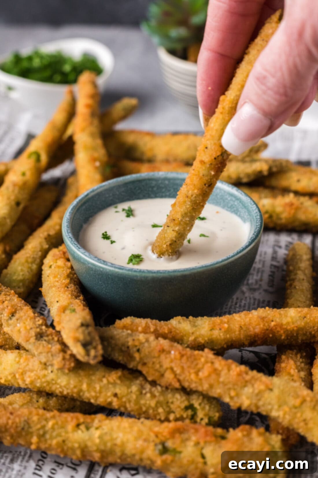 Golden Asparagus Crunch 13 Fried Asparagus being dipped into ranch