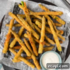 Golden Asparagus Crunch 14 Fried Asparagus on a platter with a bowl of ranch