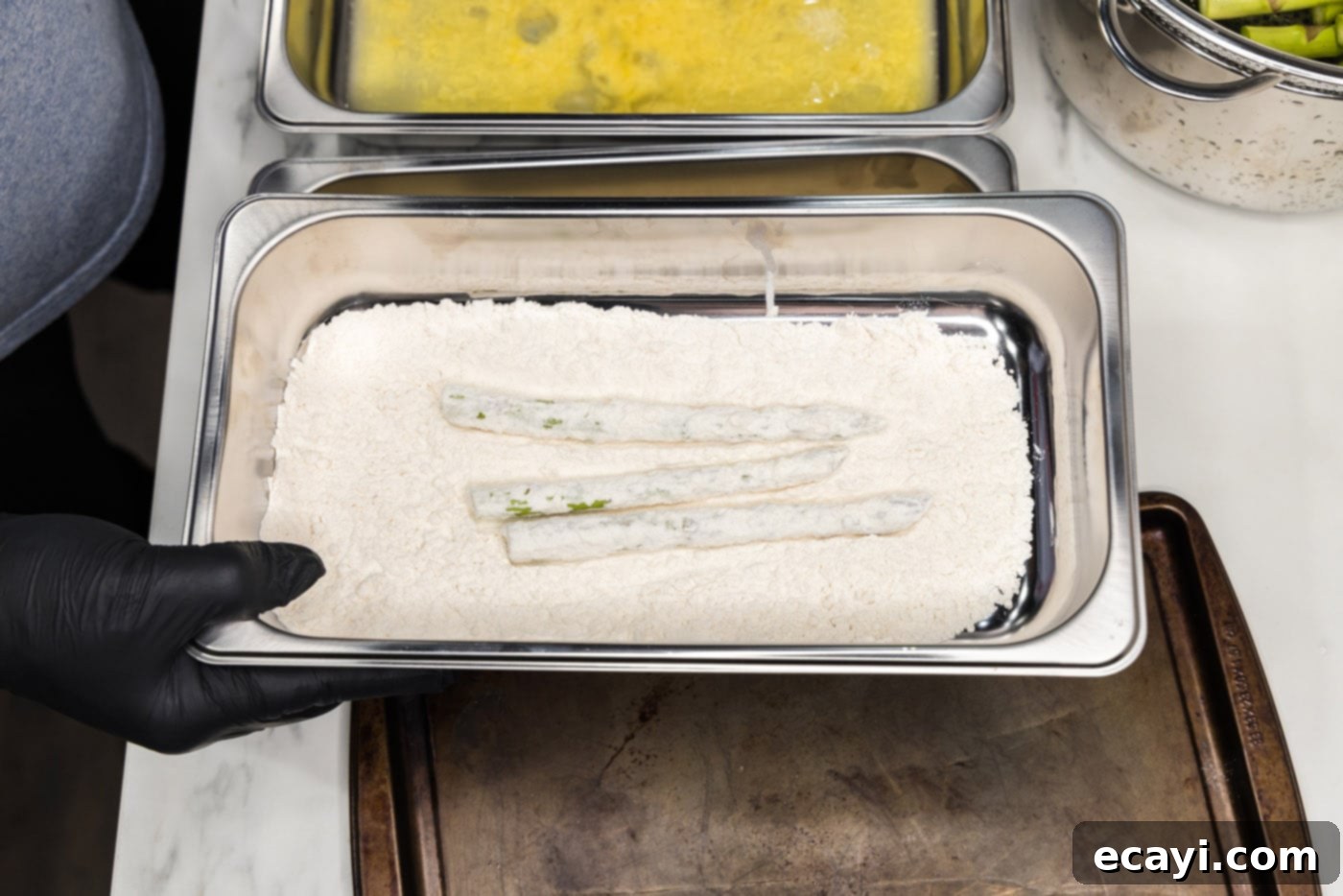 Golden Asparagus Crunch 8 dipping asparagus spears into flour