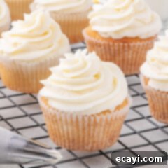 Vanilla Cupcakes 14 Close up photo of Vanilla Cupcakes on a wire rack