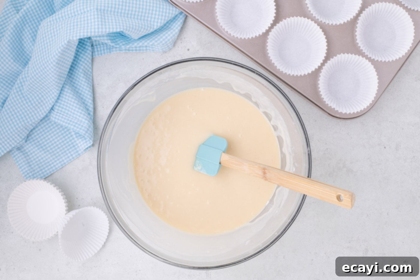 Vanilla Cupcakes 9 Gently folding the flour mixture into the vanilla cupcake batter with a rubber spatula