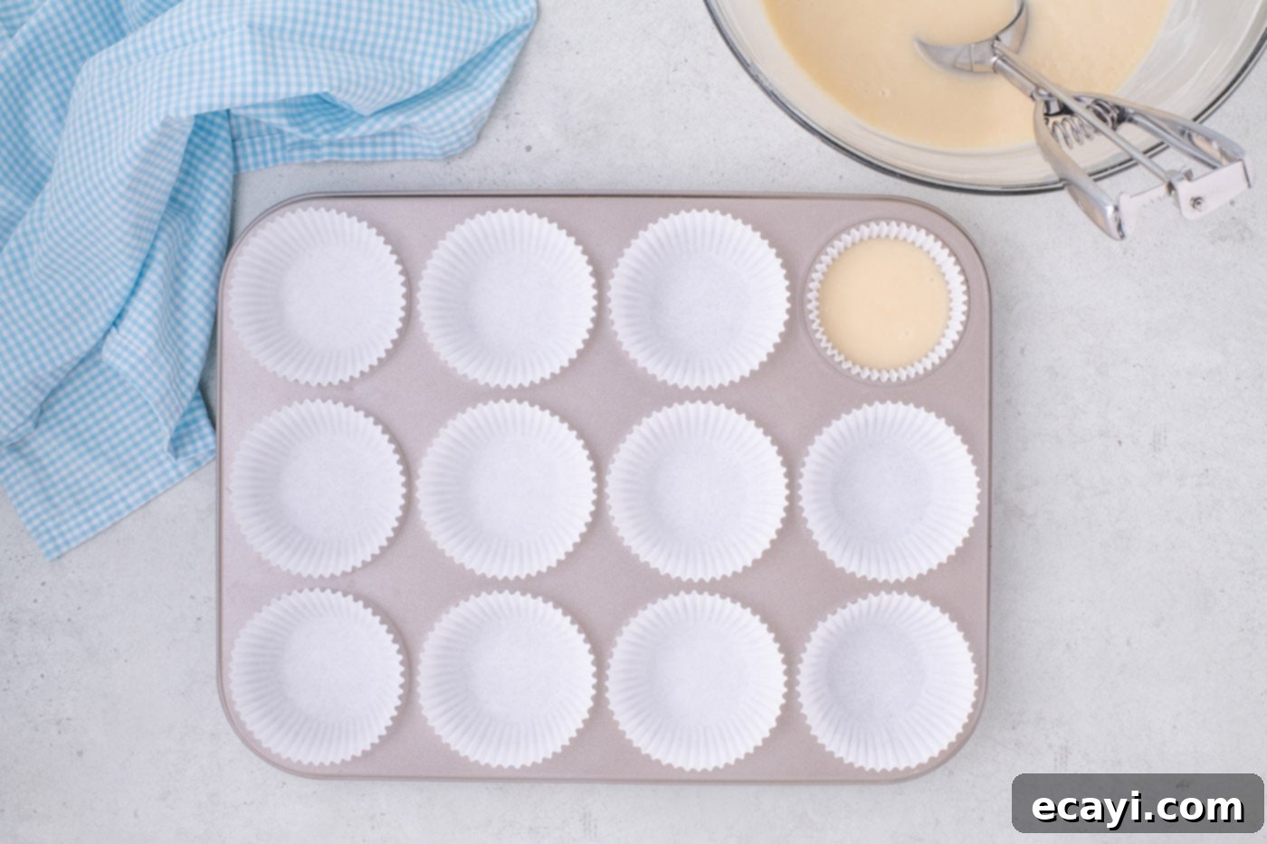 Vanilla Cupcakes 10 Filling cupcake liners evenly with creamy vanilla cupcake batter