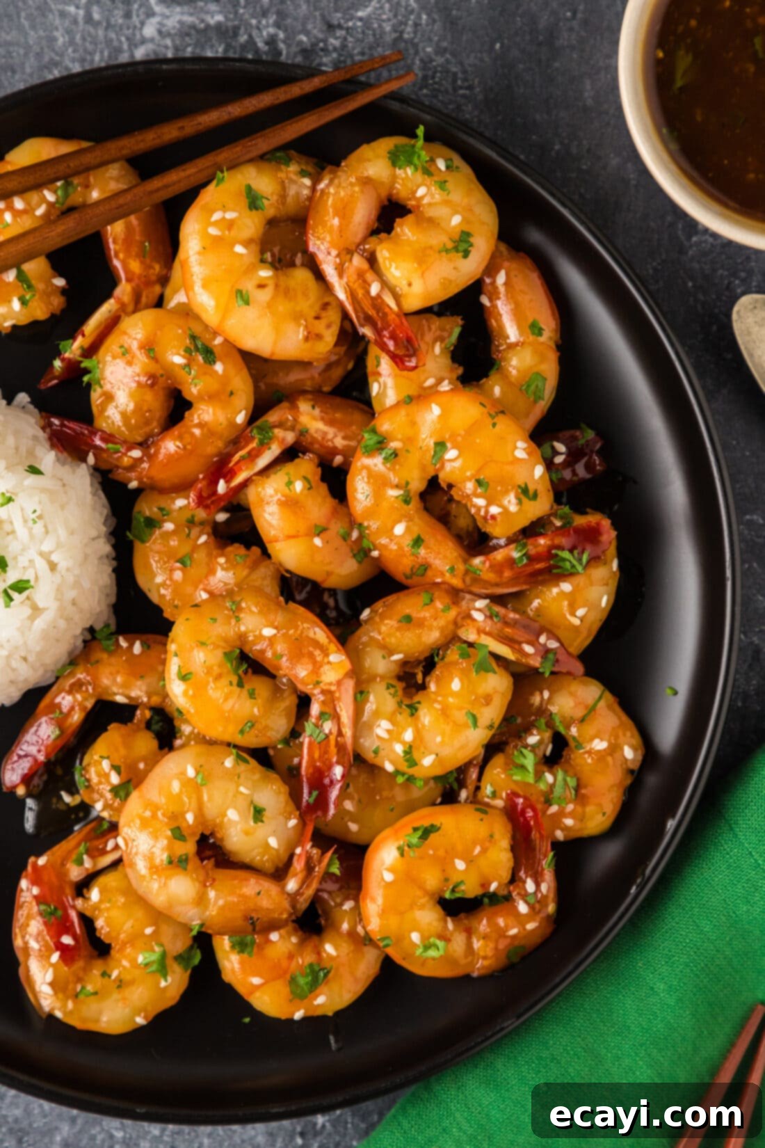 Glazed Honey Garlic Shrimp 2 Close-up photo of glistening Honey Garlic Shrimp artfully arranged on a white plate, ready to be served