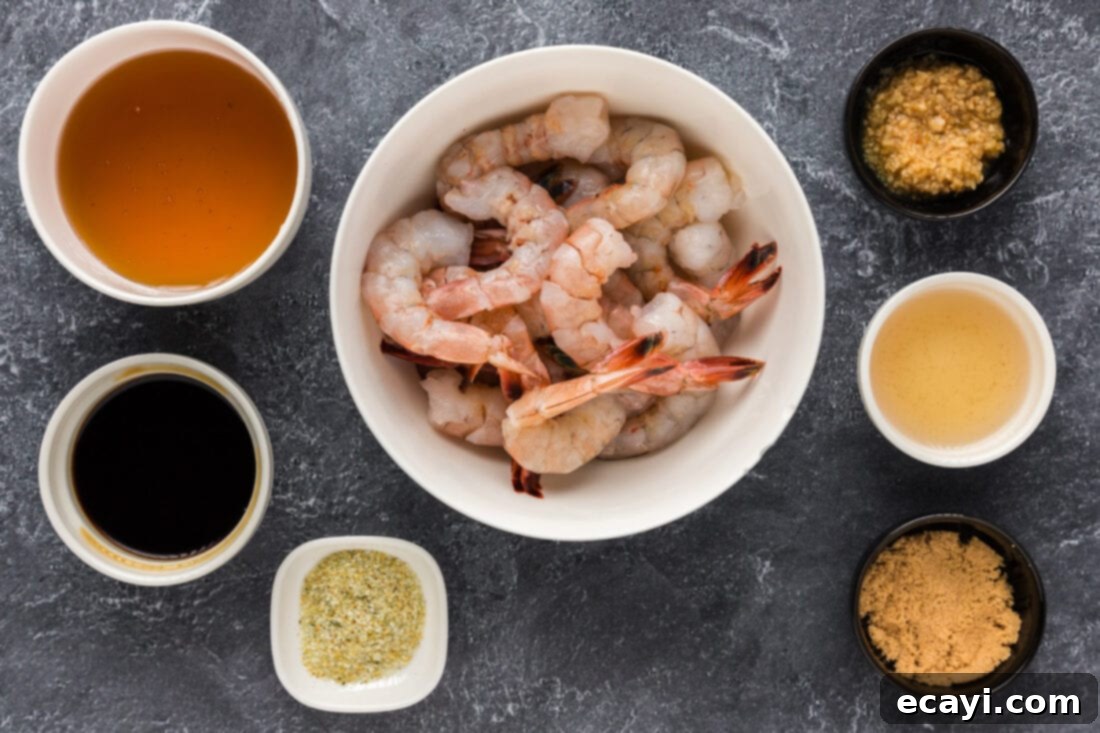 Glazed Honey Garlic Shrimp 4 A selection of fresh ingredients laid out for Honey Garlic Shrimp preparation, including shrimp, honey, soy sauce, garlic, and vinegar