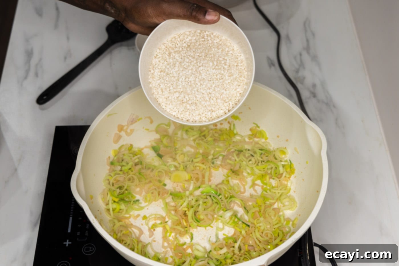 Velvet Asparagus Risotto 8 adding arborio rice to skillet with leeks and shallot mixture