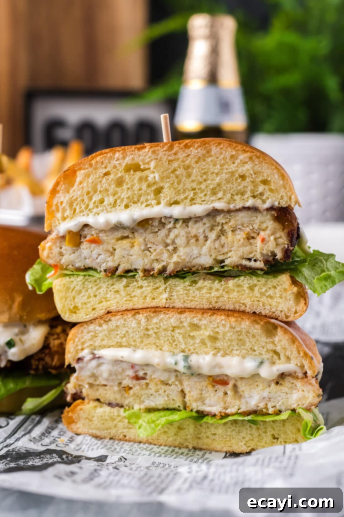 Crispy Fish Sandwich 14 Two halves of a Fish Burger stacked on top of each other, showcasing the crispy crust and flaky fish