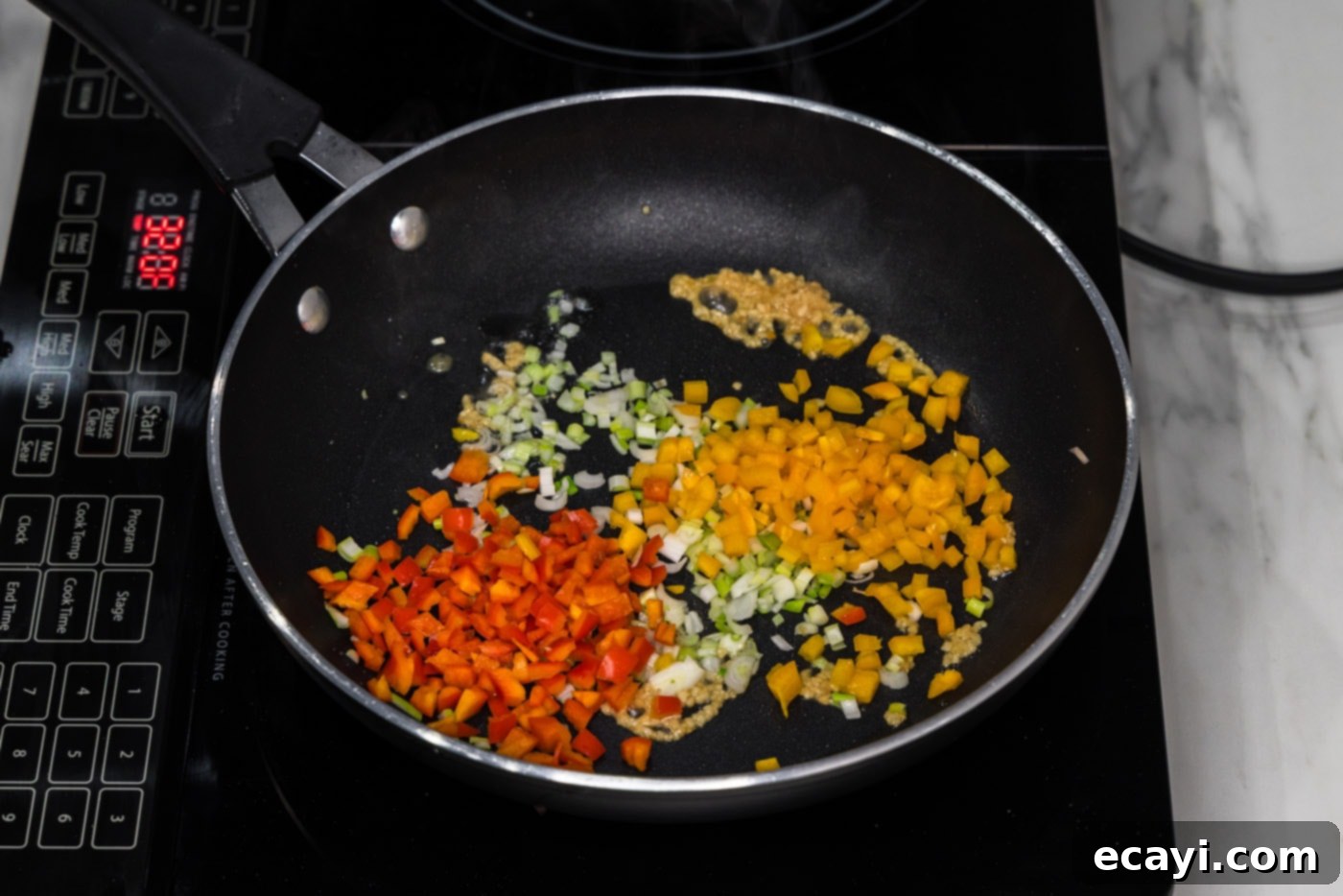 Crispy Fish Sandwich 6 peppers, garlic, and green onions sizzling in a skillet
