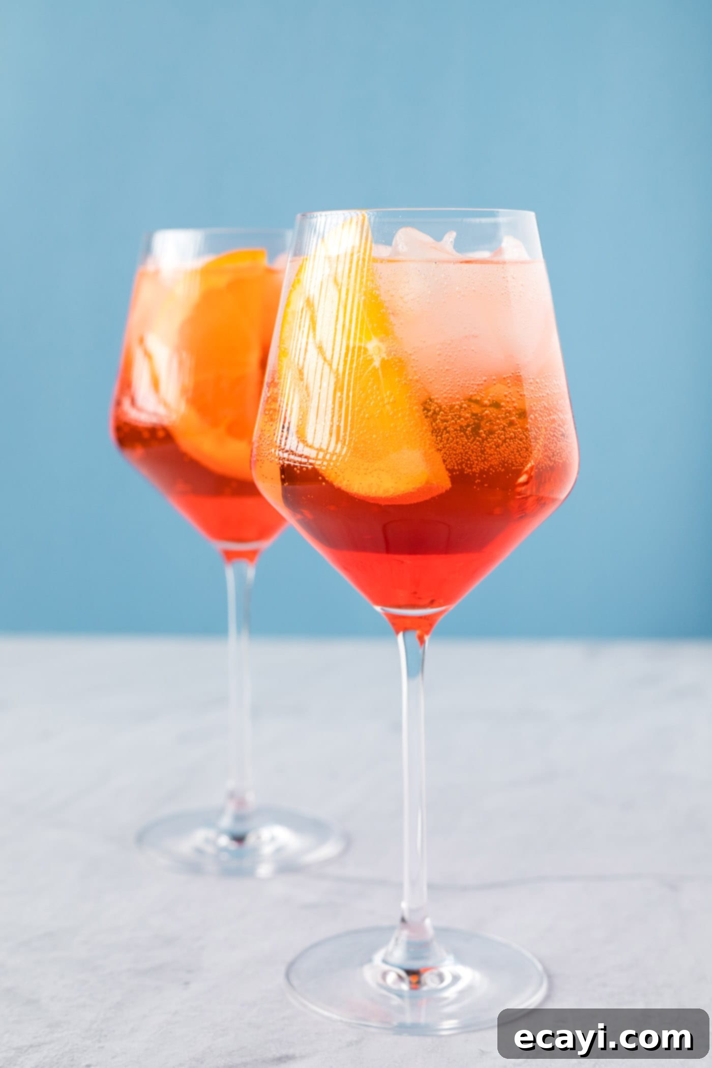 Golden Hour Aperol Spritz 7 A classic Aperol Spritz cocktail recipe in wine glasses, garnished with fresh orange slices, ready to be enjoyed.