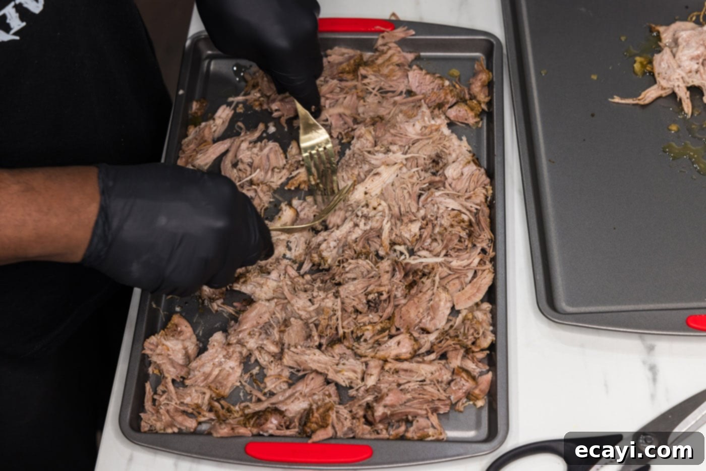 Crispy Instant Pot Carnitas 13 shredding carnitas with forks