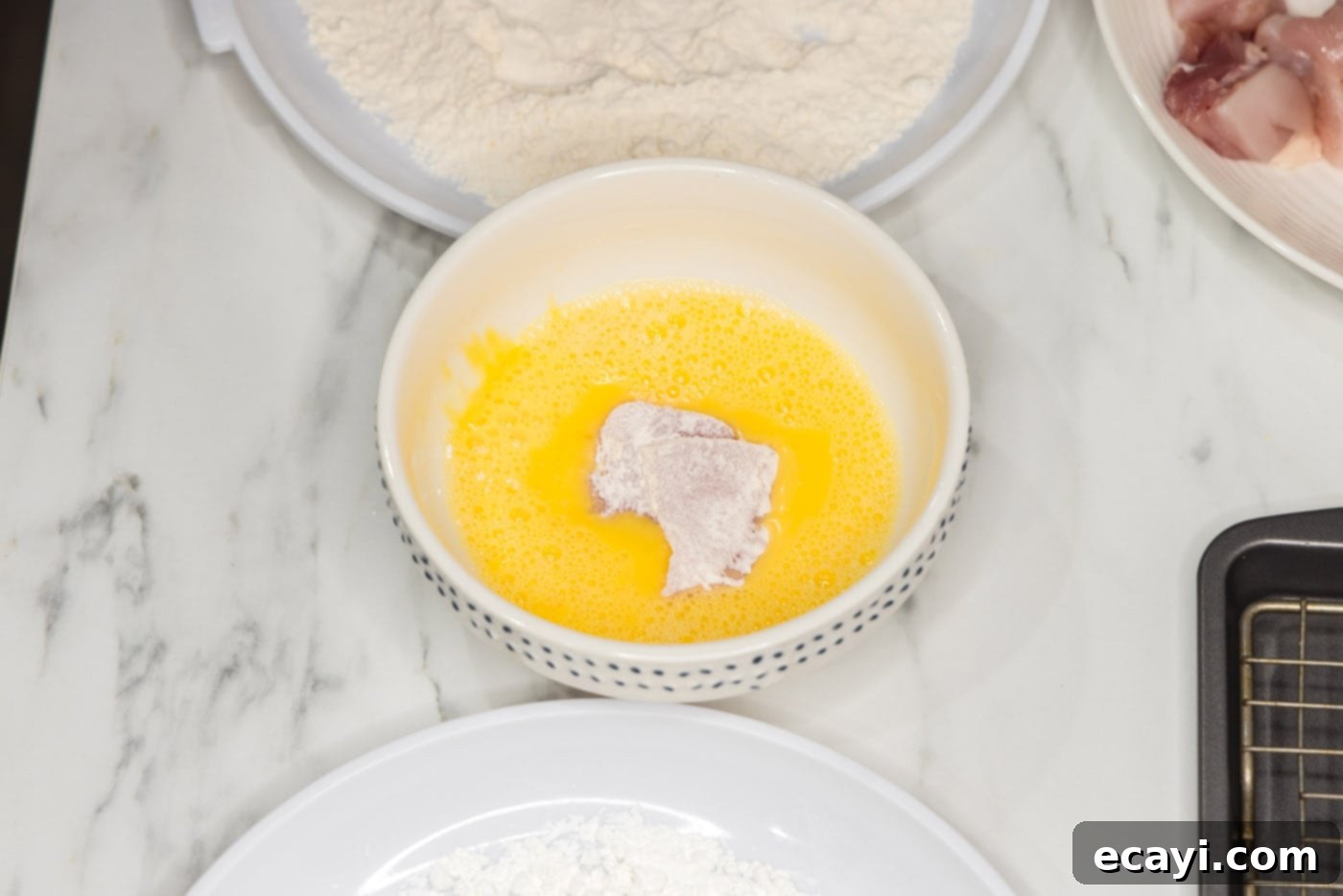 Creamy Peanut Butter Chicken 6 coating flour dredged chicken pieces in egg for a sticky surface