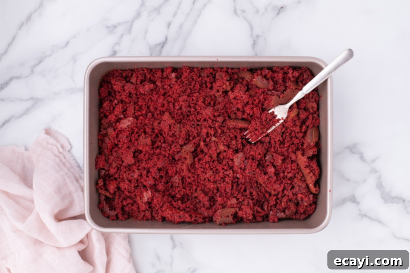 Red Velvet Truffles 9 Crumbled red velvet cake in a baking dish, ready to be mixed with frosting.