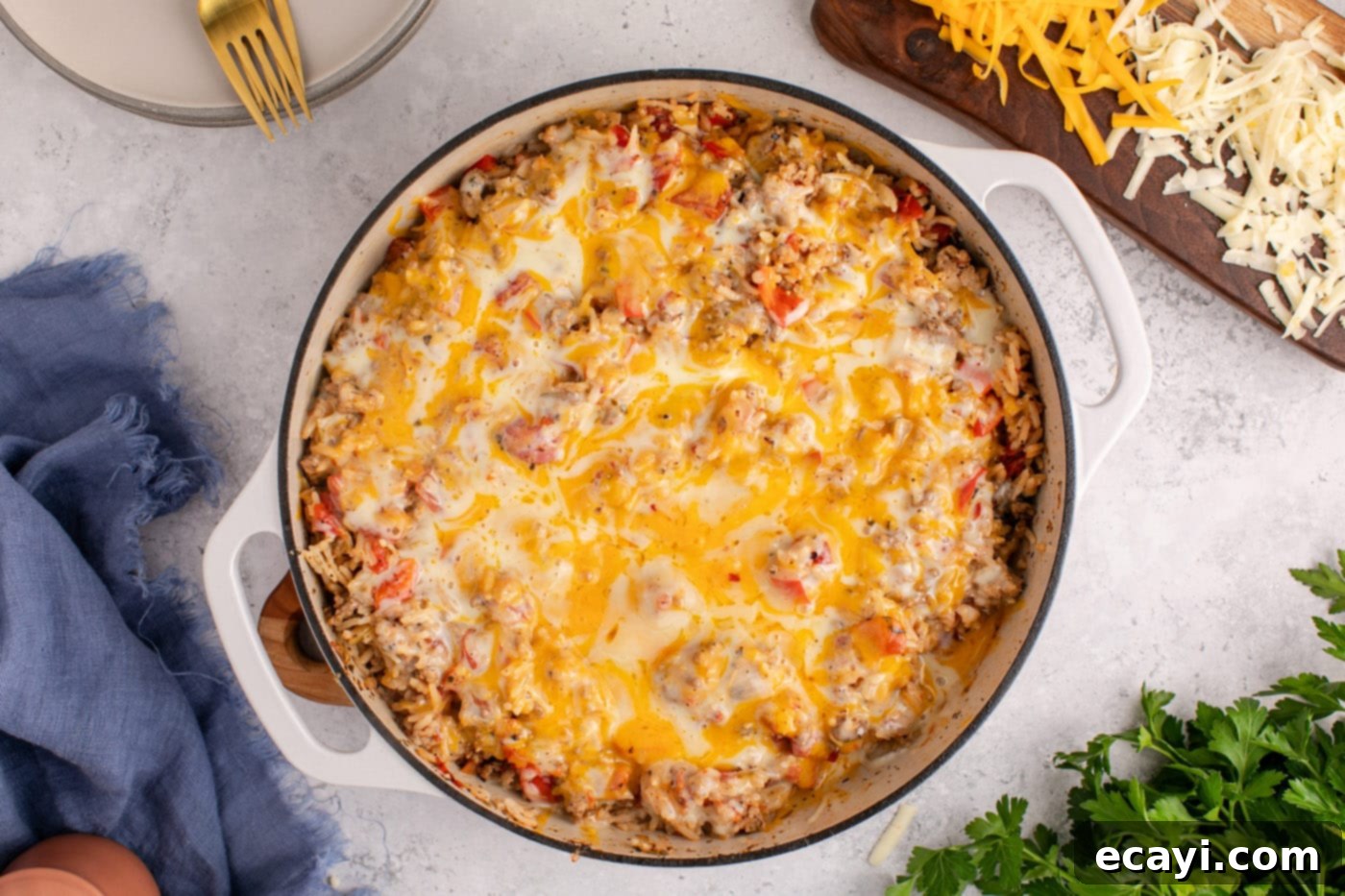 Deconstructed Stuffed Pepper Bake 11 A serving of easy stuffed pepper casserole with melted cheese and fresh parsley in a skillet, ready to eat.