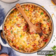 Deconstructed Stuffed Pepper Bake 13 Stuffed Pepper Casserole in a dutch oven with a spoon