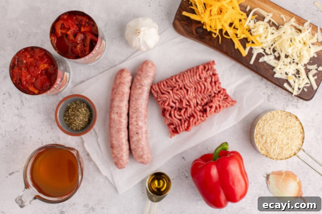 Deconstructed Stuffed Pepper Bake 4 A vibrant flat lay image showcasing all the fresh ingredients for Stuffed Pepper Casserole, including ground beef, Italian sausage, bell peppers, tomatoes, and cheeses.
