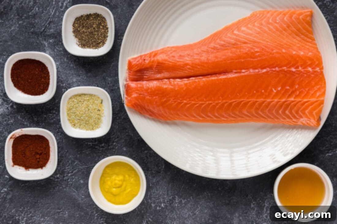 Artisan Smoked Salmon 4 A collection of ingredients for smoked salmon, including fresh salmon, mustard, honey, and a variety of spices in small bowls.