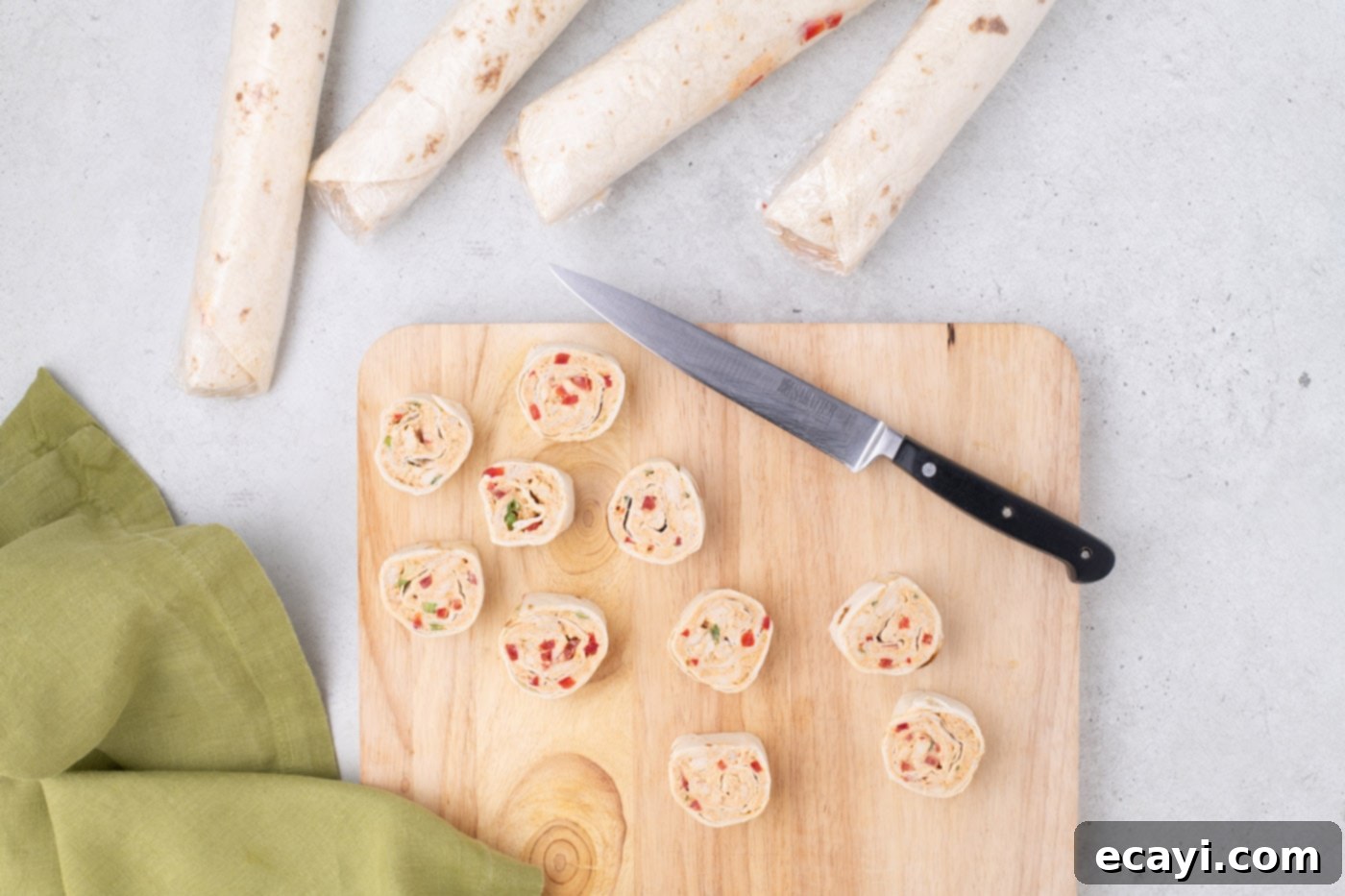 Southwest Swirls 13 sliced Mexican pinwheels on a cutting board