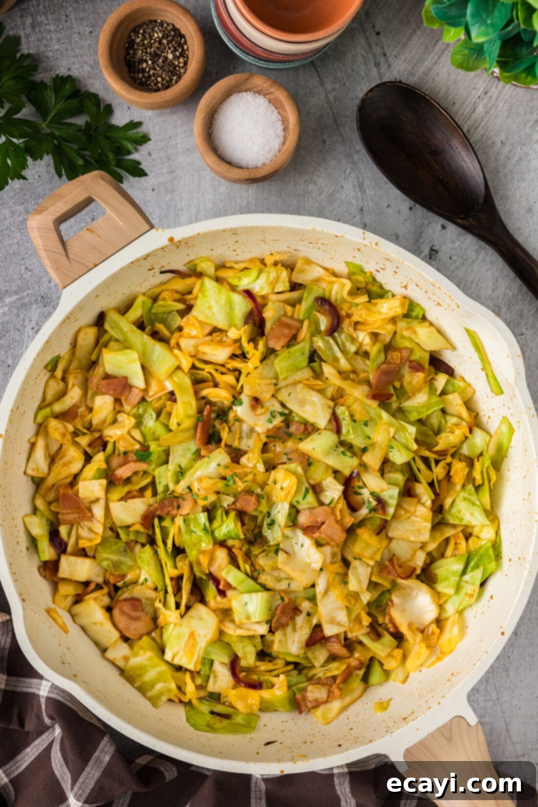 Sizzling Spicy Cabbage 9 A large skillet filled with perfectly cooked spicy fried cabbage, ready to be served, showcasing its vibrant texture and color.