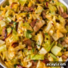 Sizzling Spicy Cabbage 10 Spicy Fried Cabbage presented in a decorative bowl, ready to be served.