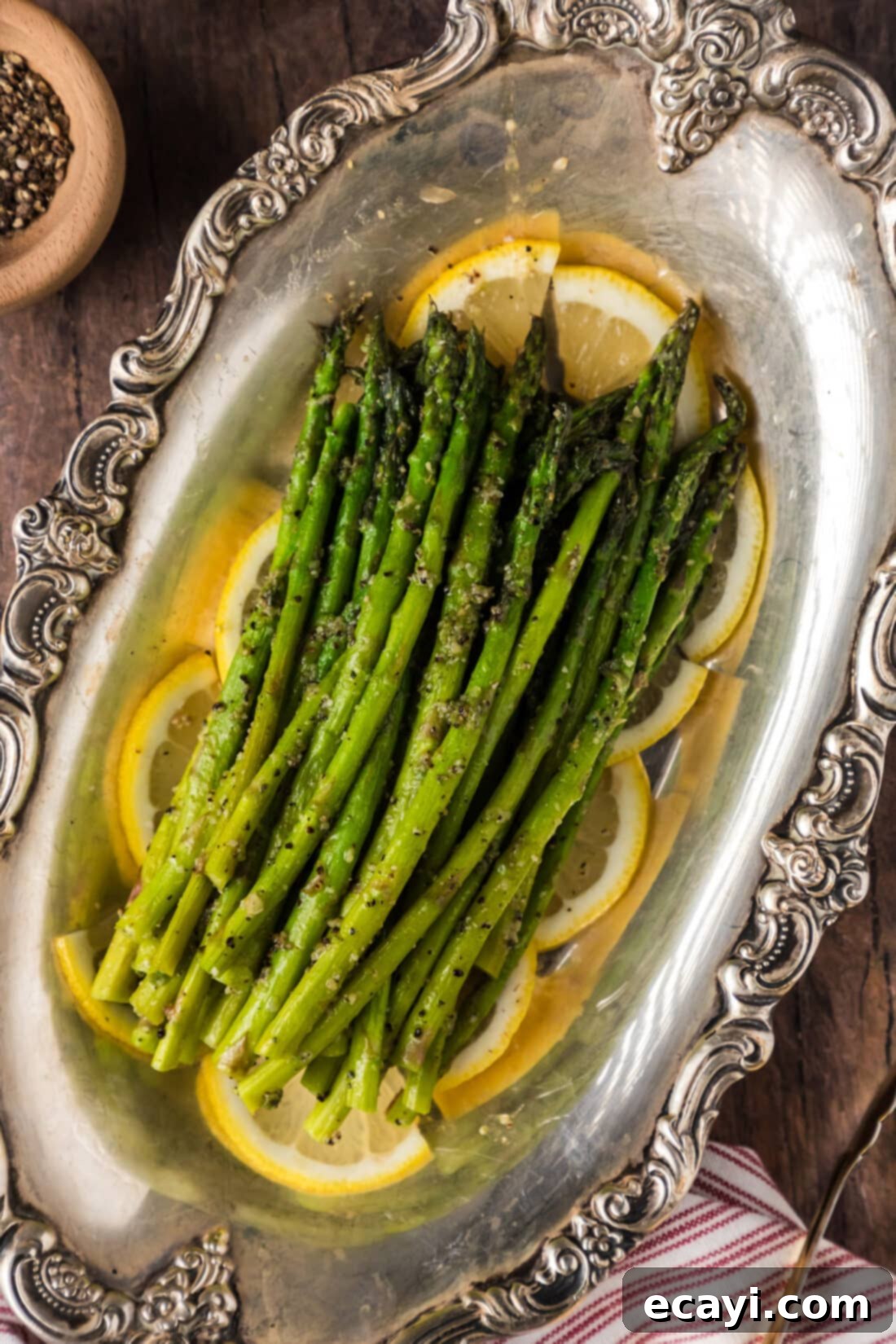 Perfectly Steamed Asparagus 2 Steamed Asparagus in an antique platter, garnished with lemon slices