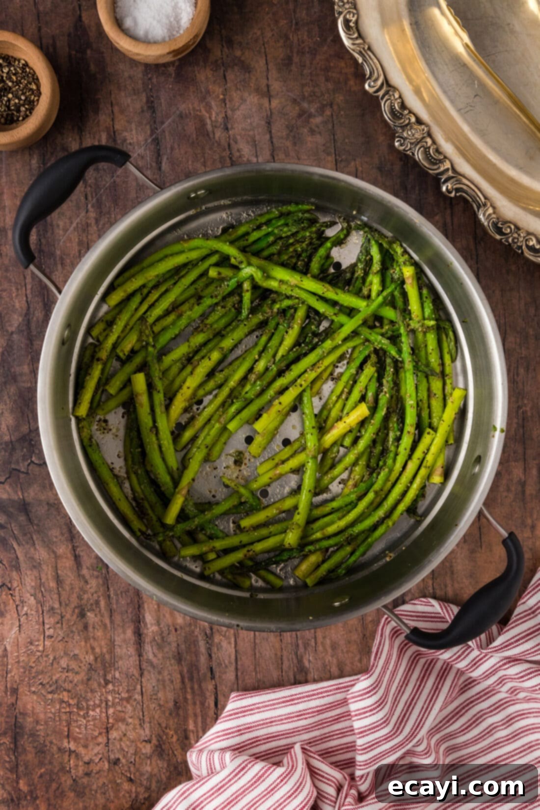 Perfectly Steamed Asparagus 3 Steamed Asparagus spears cooking in a steamer basket