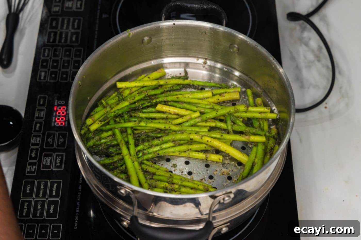 Perfectly Steamed Asparagus 8 Perfectly steamed asparagus in a pot, ready to be served
