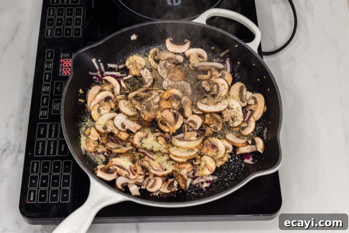 Savory Spinach Mushroom Quiche 6 Sliced mushrooms added to the skillet with the sautéed garlic and onion, ready to cook down.