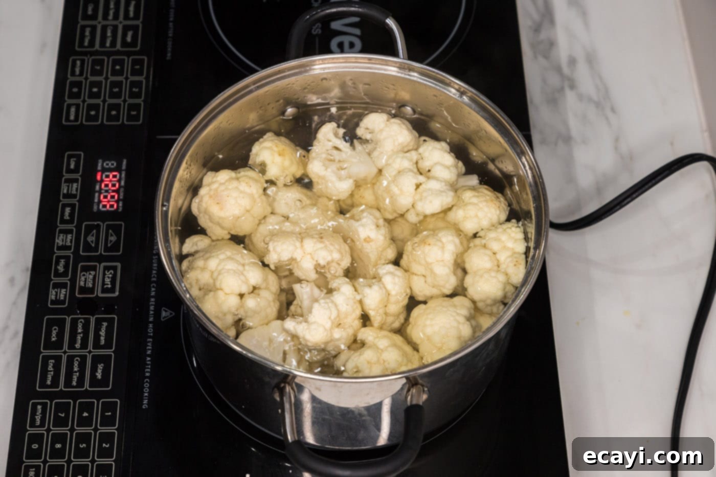 Crispy Smashed Cauliflower 5 cauliflower florets boiling in water