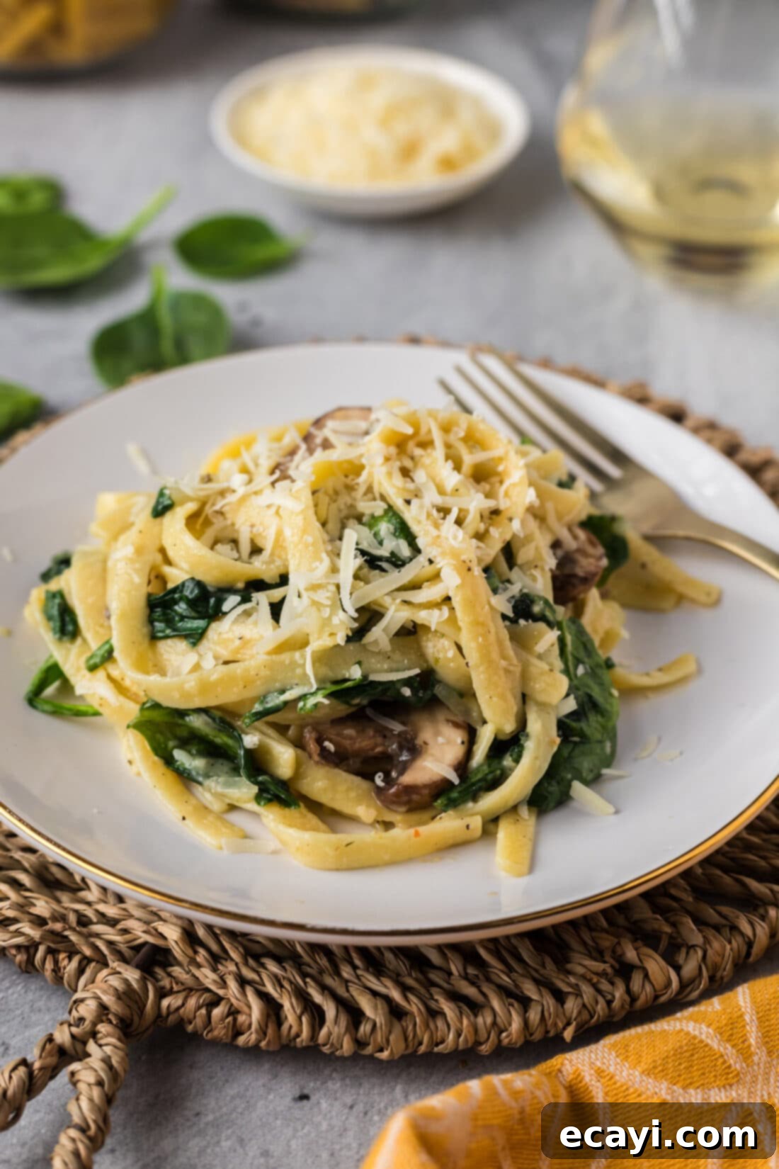 Vibrant Spinach Fettuccine 3 A plate of freshly prepared Spinach Fettuccine with a fork, ready to be savored
