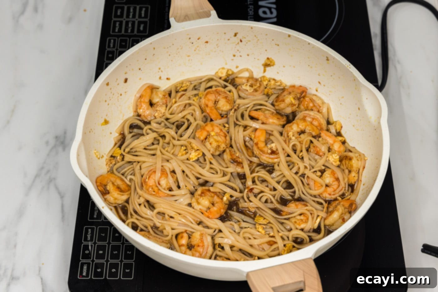 Authentic Shrimp Pad Thai 11 Easy Shrimp Pad Thai cooking in a skillet, ready to serve