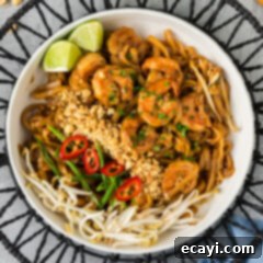 Authentic Shrimp Pad Thai 13 Bowl of Shrimp Pad Thai with chopped peanuts, bean sprouts, green onion and pepper on the side for garnish