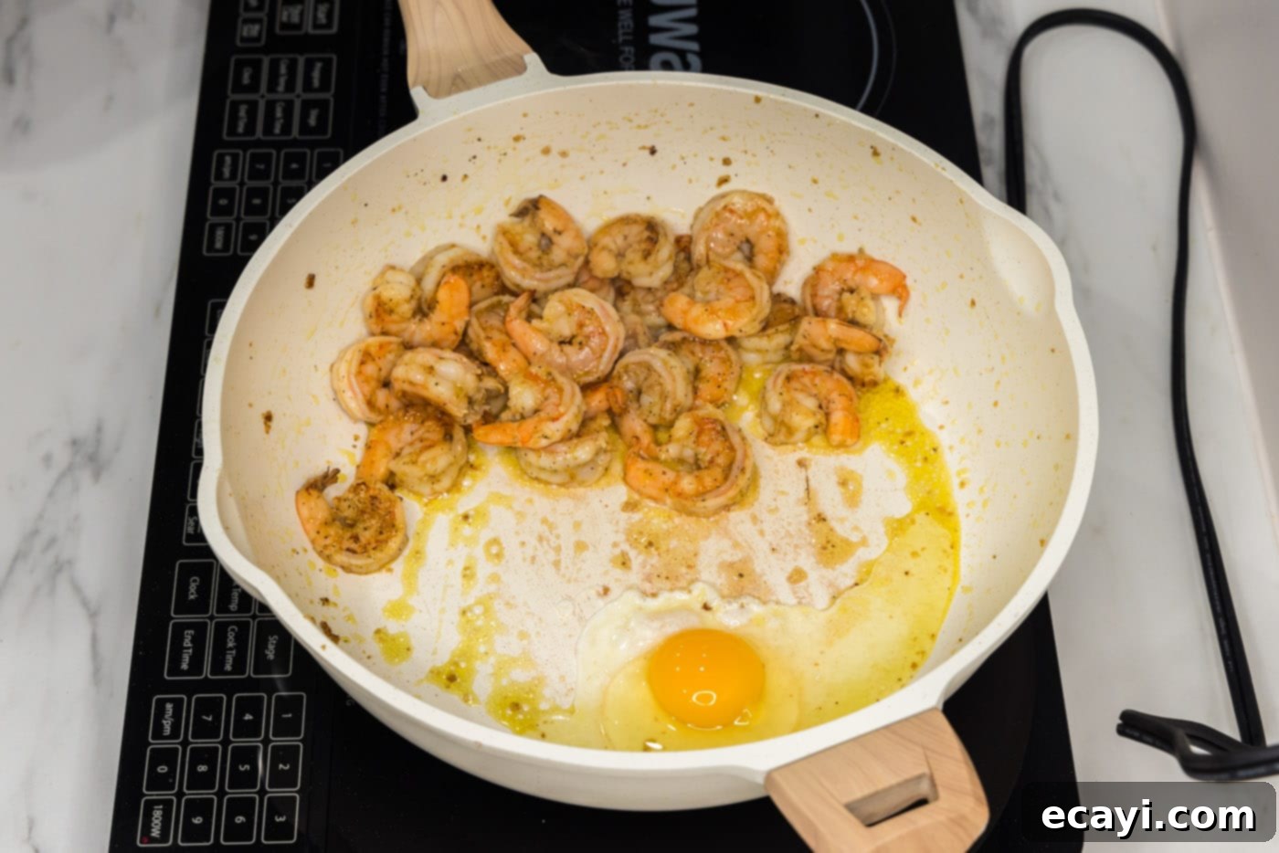 Authentic Shrimp Pad Thai 7 Sautéed shrimp with egg cooking in a skillet