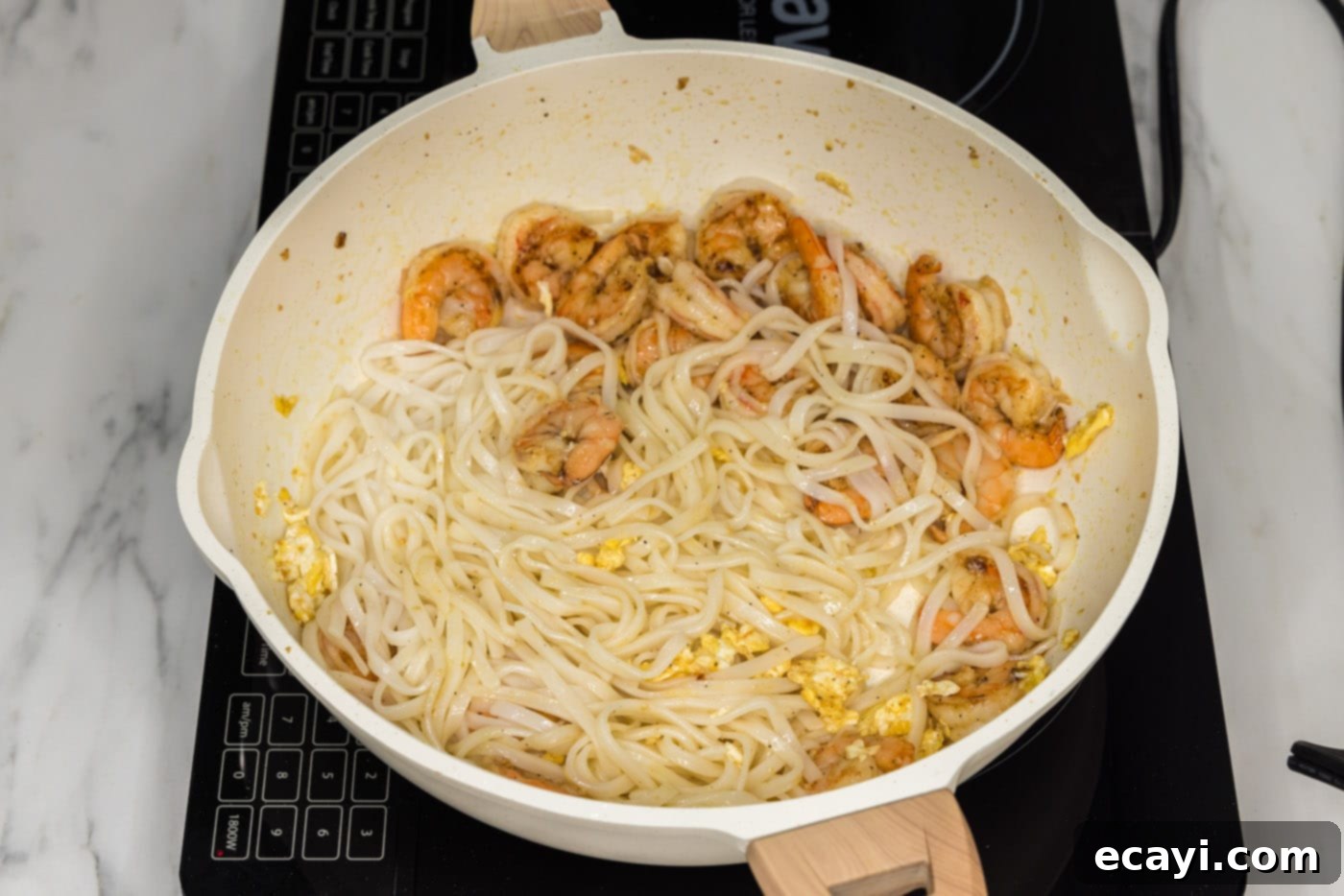 Authentic Shrimp Pad Thai 9 Cooked rice noodles added to a skillet with shrimp and scrambled egg