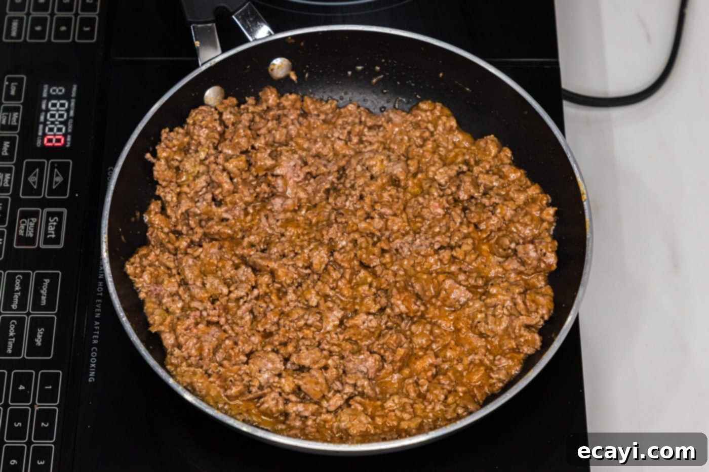 Ultimate Big Mac Egg Rolls 7 ground beef mixture in a skillet, thoroughly combined with ketchup and mustard