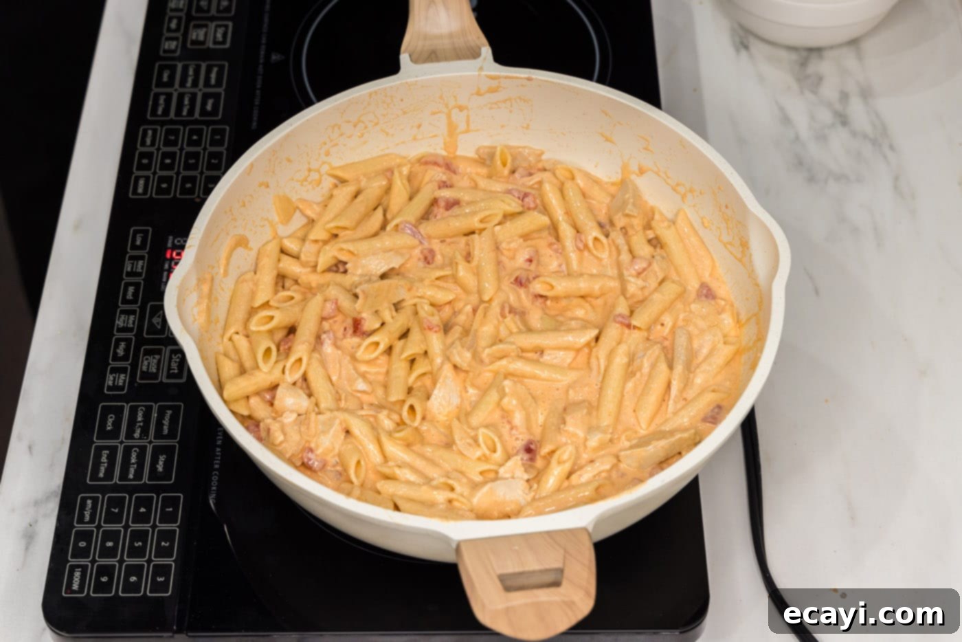 Zesty Buffalo Chicken Pasta 12 creamy buffalo chicken pasta in a skillet