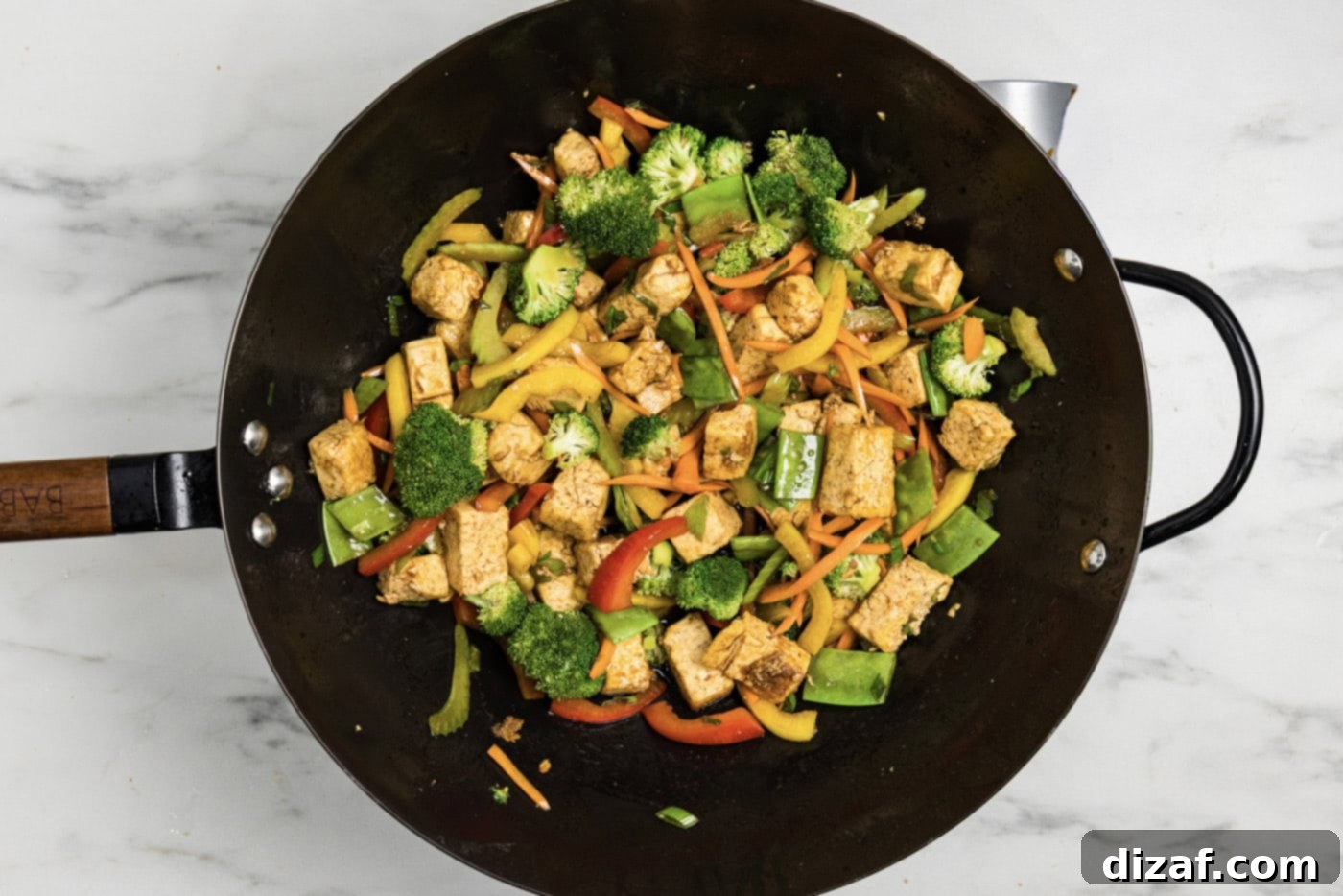 cooked tofu stir fry in a wok