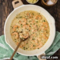 Skillet of Shrimp Risotto with a spoon in it