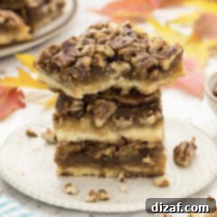 Close up photo of a stack of Pecan Pie Bars with a bite taken out of one
