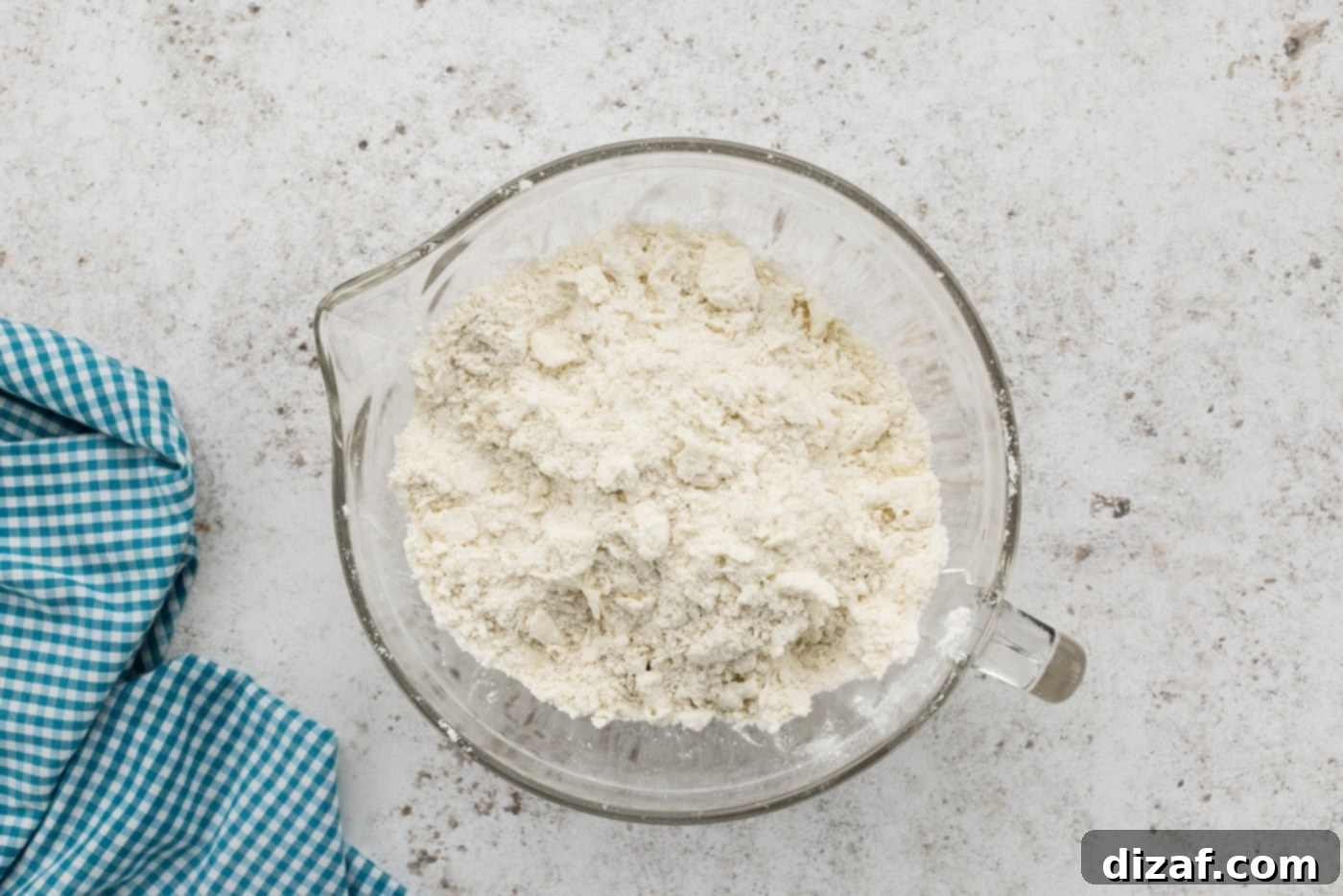 coarse crumbed shortbread mixture in a mixing bowl before being pressed into the pan