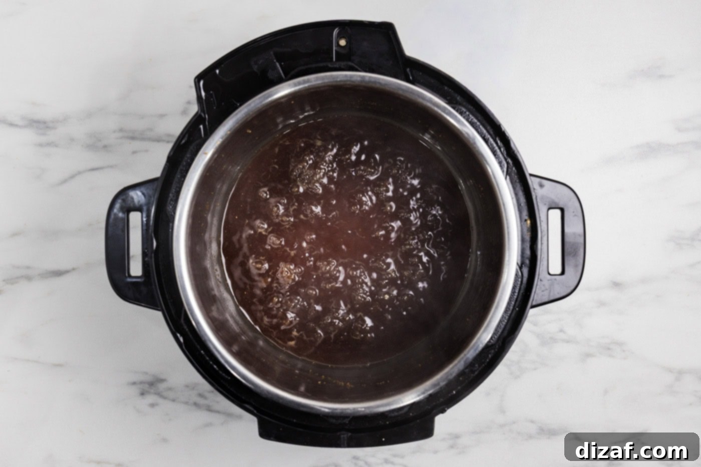 Honey Garlic Chicken in the Instant Pot 8 Honey garlic sauce boiling in the instant pot