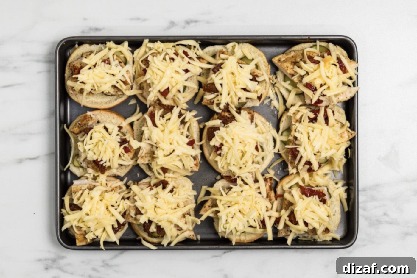 shredded gouda cheese over top chicken sliders