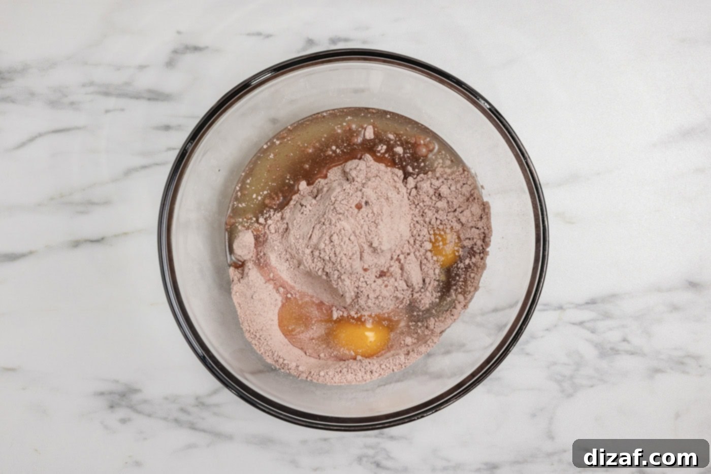cake mix, oil, and eggs in a mixing bowl