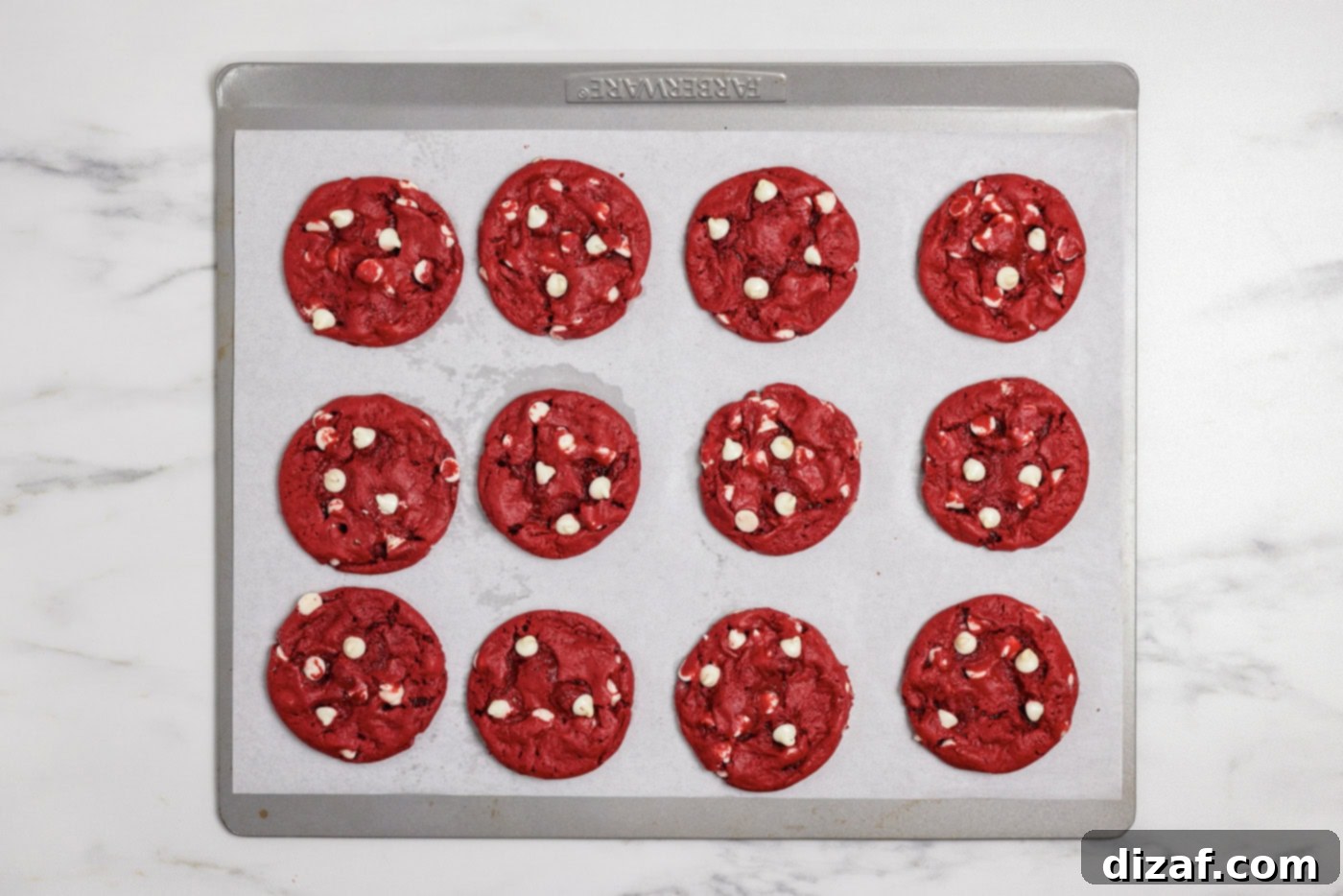red velvet cookies on a baking sheet