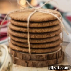 Close up photo of a stack of Crispy Gingersnap Cookies wrapped in twine