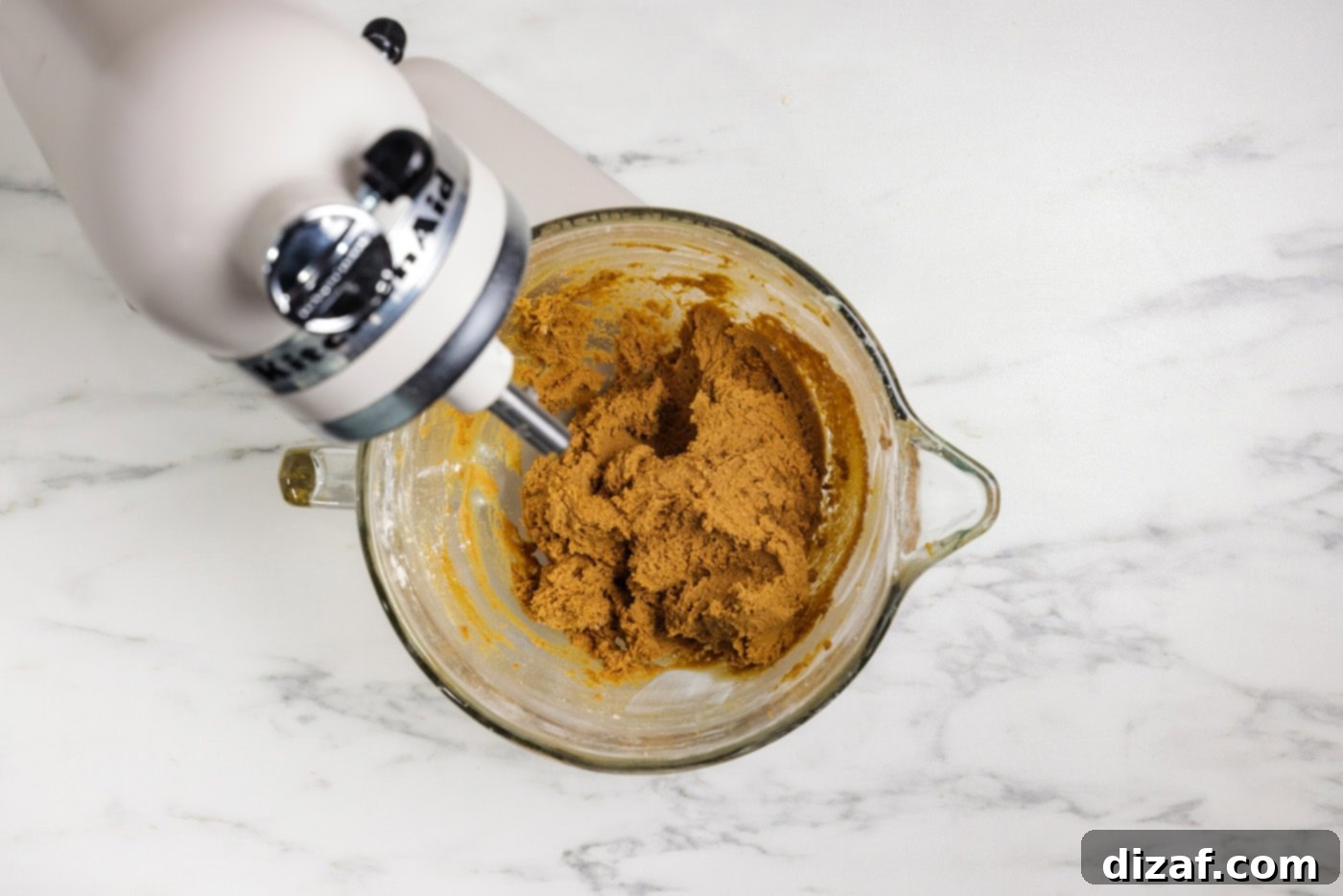 Gingersnap cookie dough in a stand mixer bowl