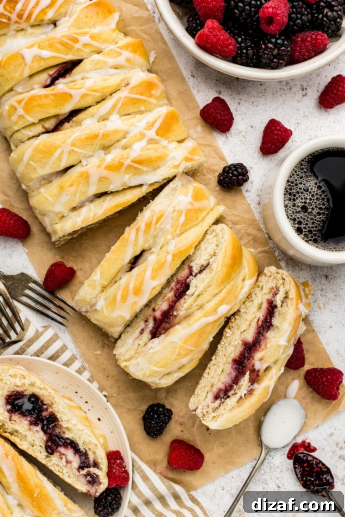 Braided Breakfast Danish cut into slices on parchment paper